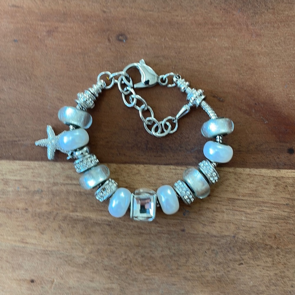 Bracelet with star fish charm.
